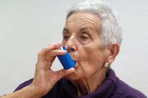 old woman with an inhaler