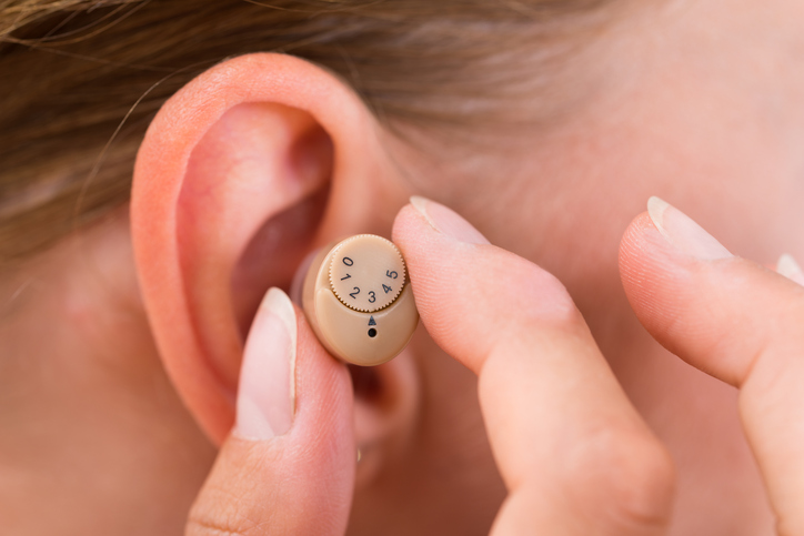 Tinnitus treatment with hearing ...