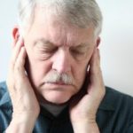 How does TMJ (temporomandibular joint) disorder cause tinnitus, hearing problems?