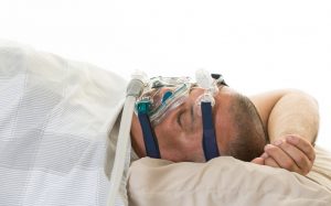 Overweight man suffering from sleep apnea