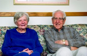 Senior couple sitting on couch