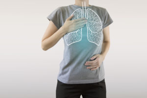 highlighted blue healthy lungs on woman body