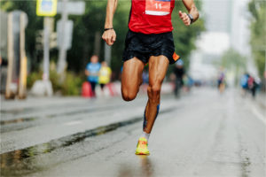 man runner leader of marathon race run street of city