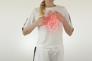 highlighted red heart disease on woman body