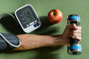 Healthy concept. Exercise and healthy eating are the causes of normal blood pressure.