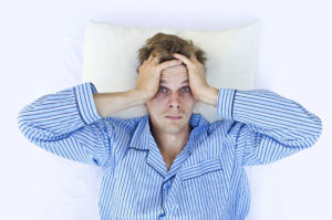 A man not able to get to sleep because of stress
