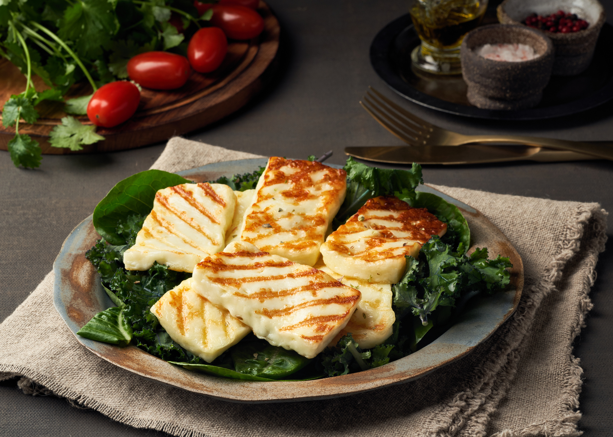 Cyprus fried halloumi cheese with healthy green salad. Lchf, pegan, fodmap, paleo, scd, keto, ketogenic diet. Balanced food, a greek clean eating recipe.