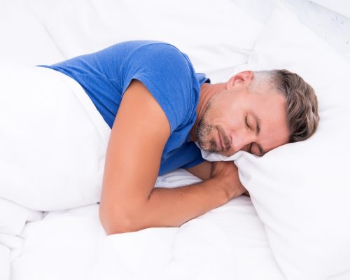 Sleeping beauty. Man handsome guy lay in bed. Get enough amount of sleep every night. Tips sleeping better. Bearded man sleeping face relaxing on pillow. Pleasant relaxation concept. Perfect rest.