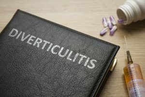 Book about Diverticulitis and medication, injection, syringe and pills