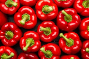 red peppers full frame on black background