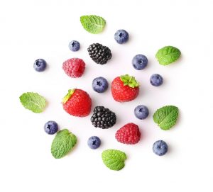 Fresh summer berries isolated on white background. Top view
