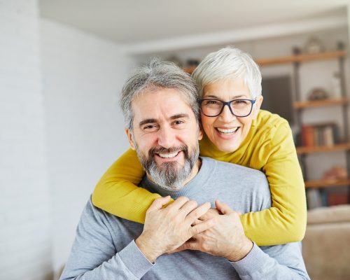 portrait of happy smiling senior couple at home