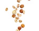oatmeal with nuts and raisins on a white background