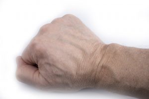 Man veiny wrist on a white background