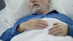 Senior man sleeping in bed and snoring, problems with sleep, health care, stock footage