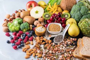 Healthy balanced dieting concept. Selection of rich fiber sources vegan food. Vegetables fruit seeds beans ingredients for cooking (Healthy balanced dieting concept. Selection of rich fiber sources vegan food. Vegetables fruit seeds beans ingredients