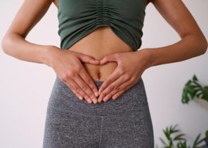 Close up of a woman's hands on her stomach. High quality photo